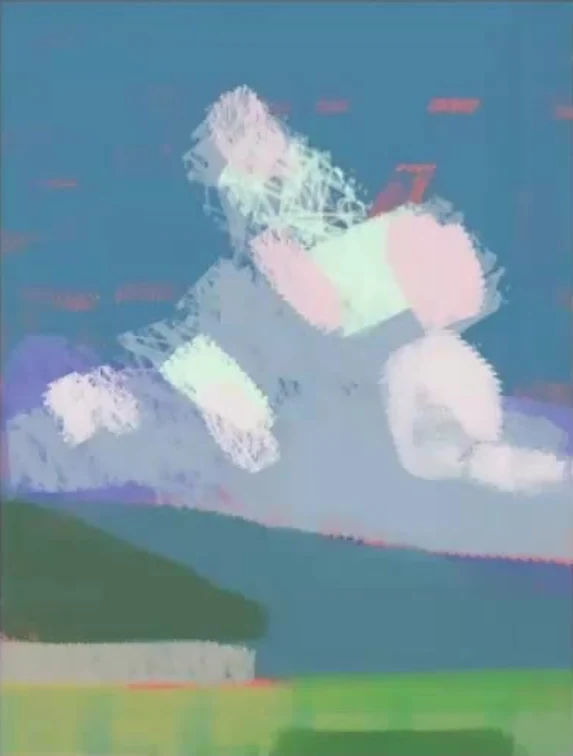 Large shapes of sky, mountains, and meadow under the clouds.